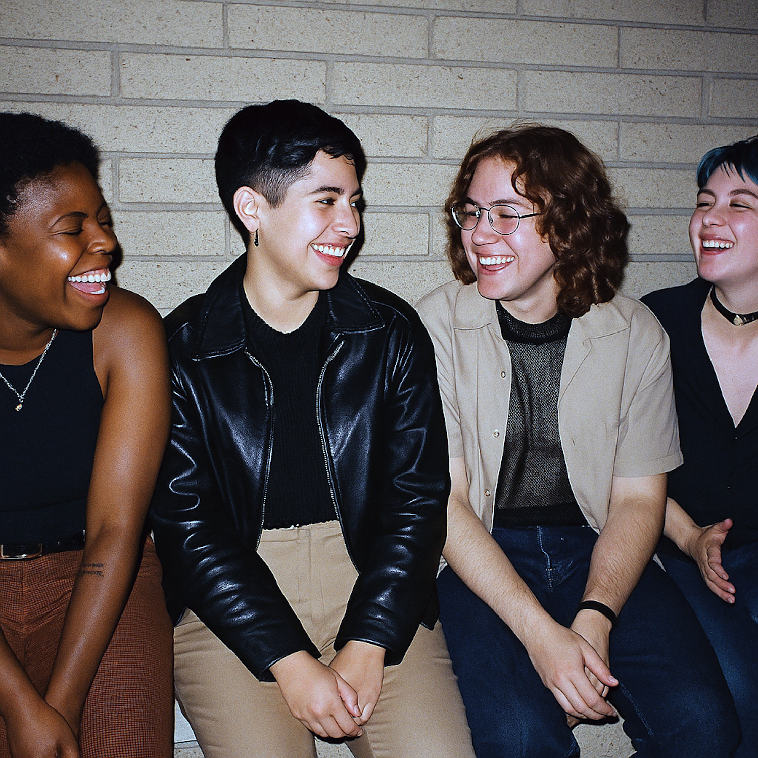 A diverse group of people engaged in lively conversation and laughter, representing the community built around humor in literary magazines.