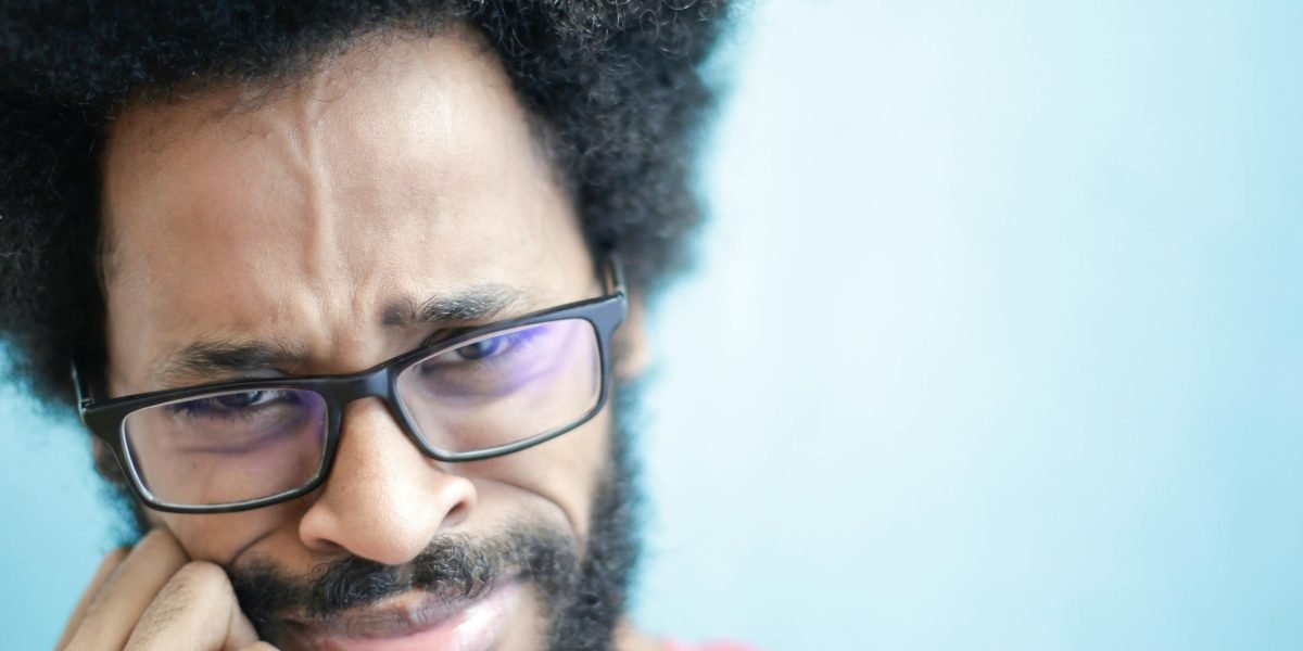 A person pondering, representing the initial confusion some viewers had with the show's unusual premise.