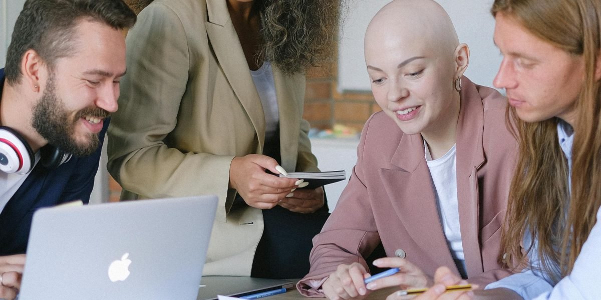 A team collaborating in a cheerful and engaged manner, symbolizing successful brand connection.