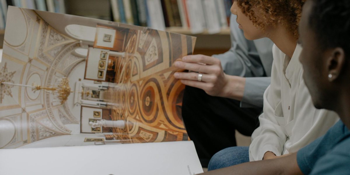 Friends gather for a book club, using images to spark lively and humorous discussions about their reading.