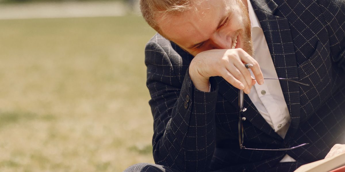 A person enjoying a humorous story, reflecting the universal appeal of comedy.